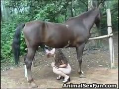 A harlot girl sucks a horse and then gulps down the animal's fluids.